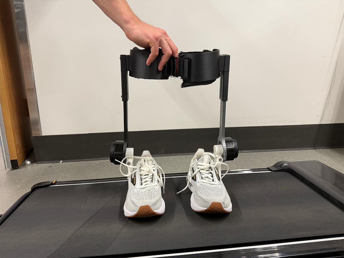Exoskeleton worn on treadmill, both legs photo